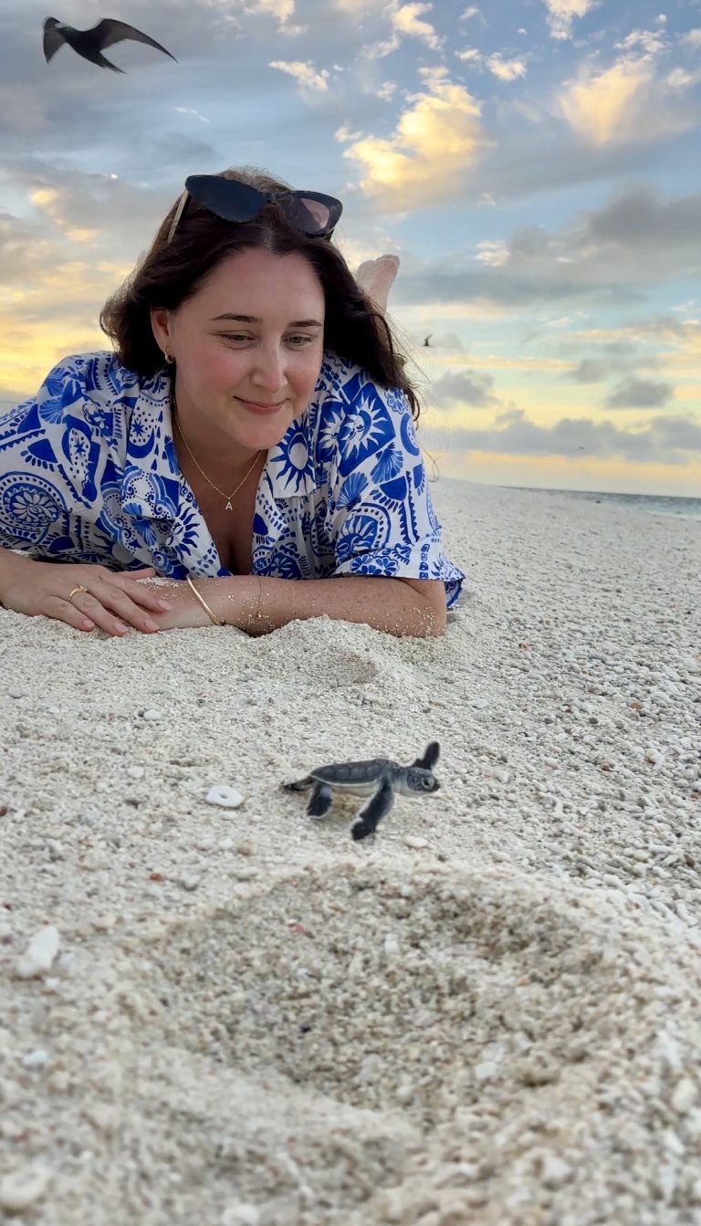 Amy Gash with baby turtle
